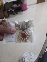 Dancing peacock brooch