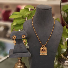 Narmada golden pendent set