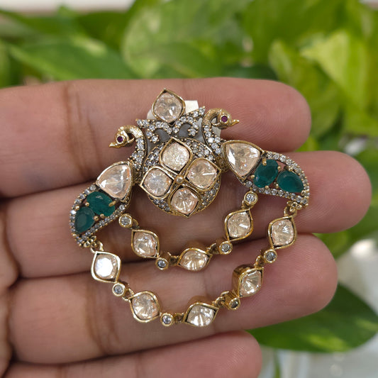 The two peacocks brooch