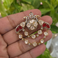The two peacocks brooch